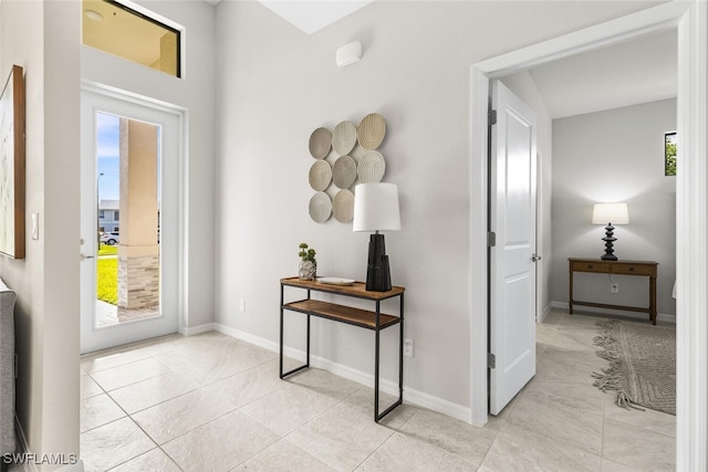 foyer entrance featuring light tile patterned floors