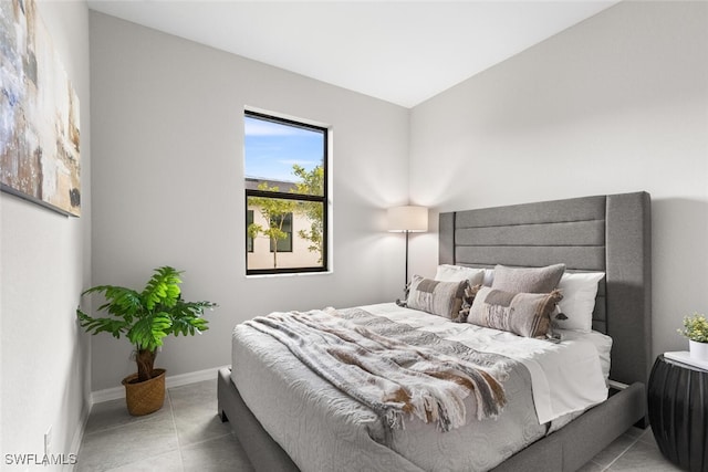 tiled bedroom with baseboards