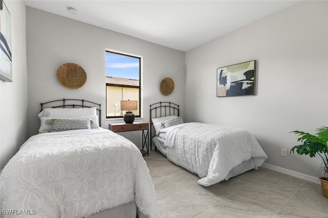 bedroom featuring baseboards