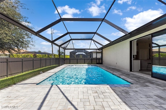 view of pool featuring a lanai and a patio area