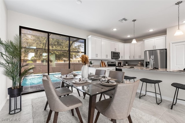 dining room featuring light tile patterned flooring