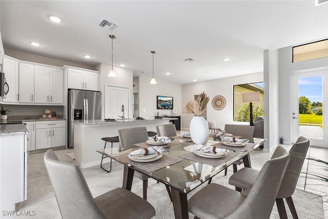 dining space featuring baseboards, marble finish floor, visible vents, and recessed lighting