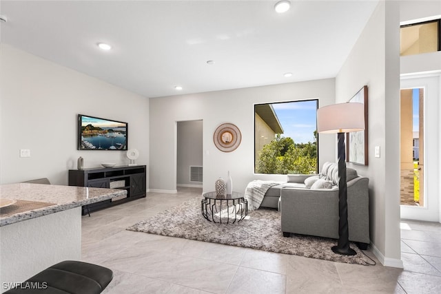 living room featuring light tile patterned floors