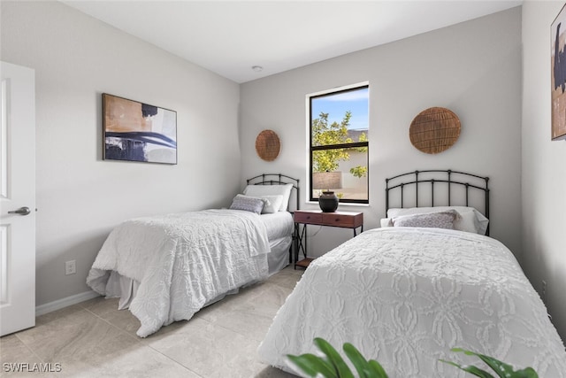 bedroom featuring baseboards