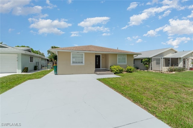 single story home with a front yard and a garage