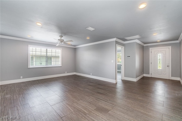 foyer entrance featuring ceiling fan, crown molding, and a healthy amount of sunlight