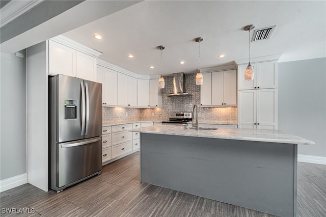 kitchen featuring white cabinets, appliances with stainless steel finishes, dark hardwood / wood-style flooring, sink, and wall chimney range hood