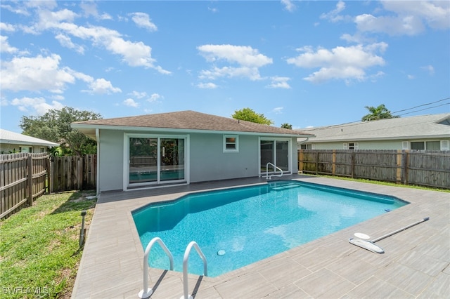 view of swimming pool featuring a patio area