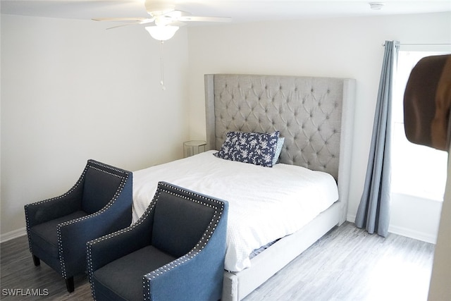 bedroom featuring ceiling fan and light wood-type flooring