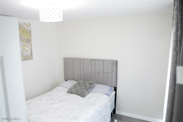 bedroom featuring wood-type flooring