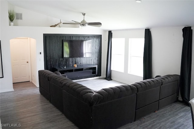 living room featuring lofted ceiling, hardwood / wood-style flooring, and ceiling fan