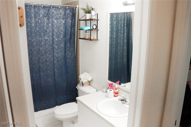 bathroom with vanity, toilet, tile patterned floors, and walk in shower