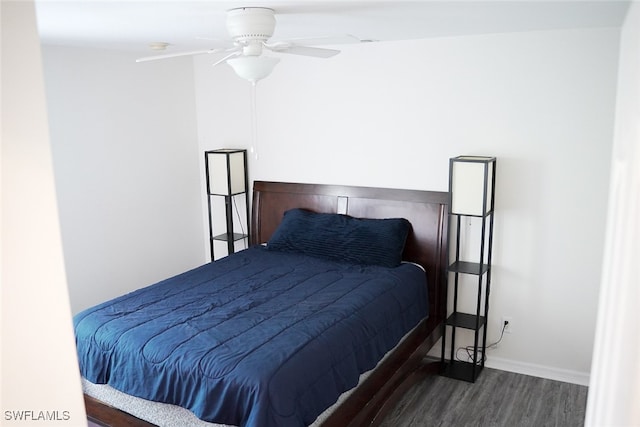 bedroom featuring dark wood-type flooring and ceiling fan