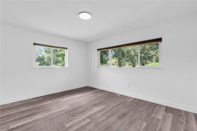 spare room with light hardwood / wood-style floors