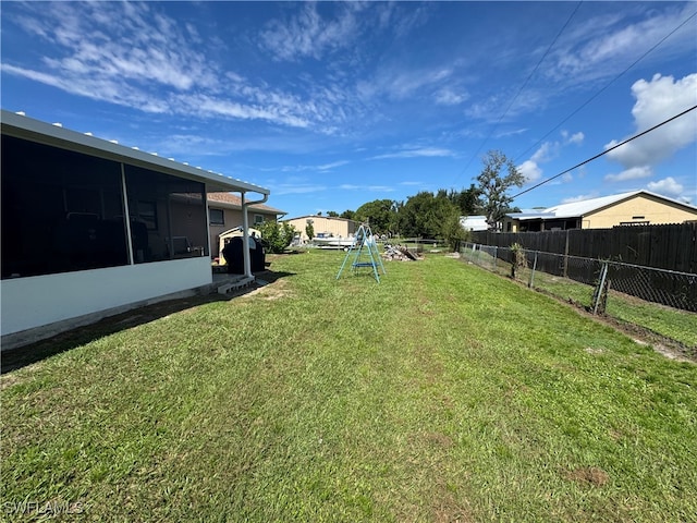 view of yard with a sunroom