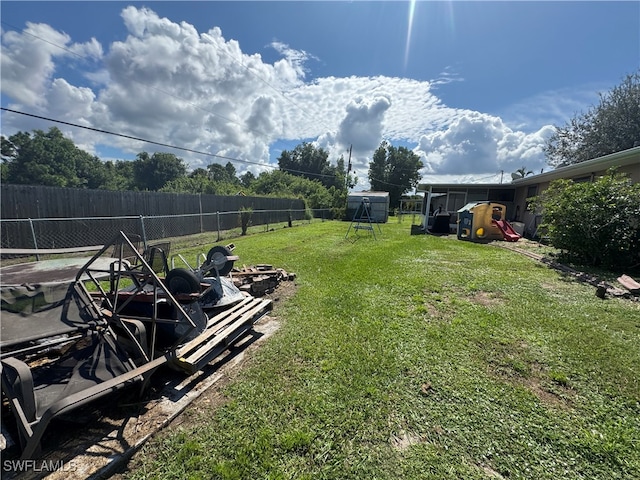 view of yard with an outdoor fire pit