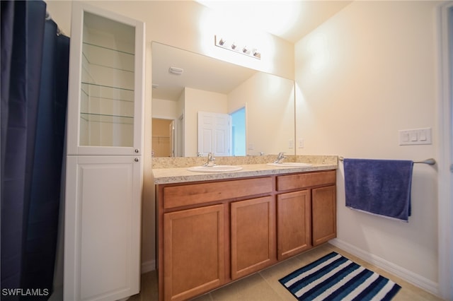 bathroom with vanity and tile patterned flooring