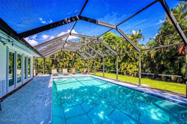 view of pool featuring a patio area and a lanai