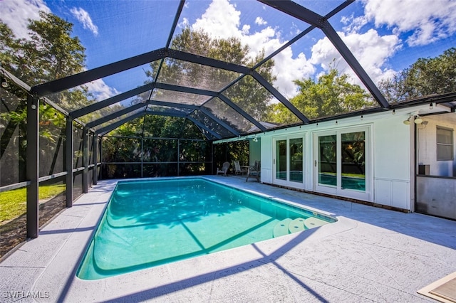 view of pool with a lanai and a patio