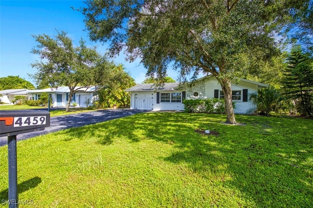 ranch-style house with a front lawn