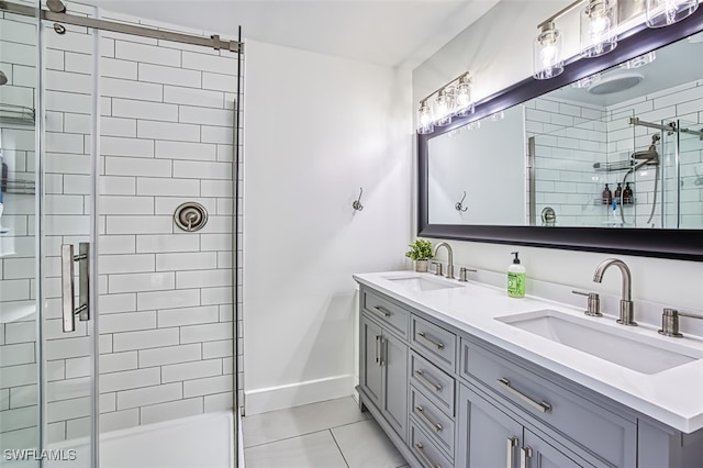 bathroom with vanity, an enclosed shower, and tile patterned floors