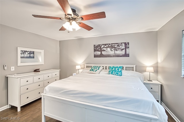 bedroom featuring ceiling fan and dark hardwood / wood-style flooring