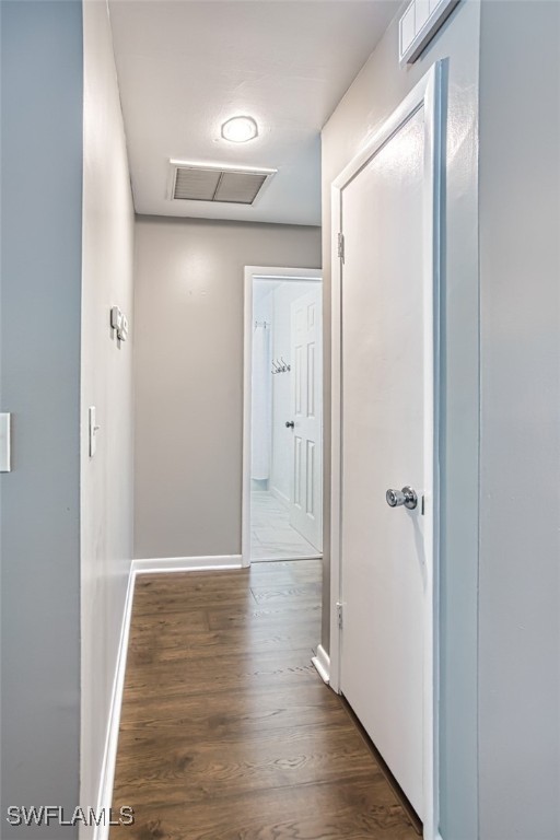 hall with hardwood / wood-style floors