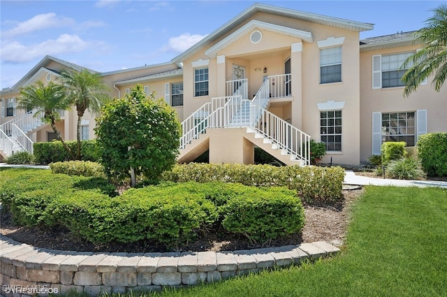 view of property featuring stairs