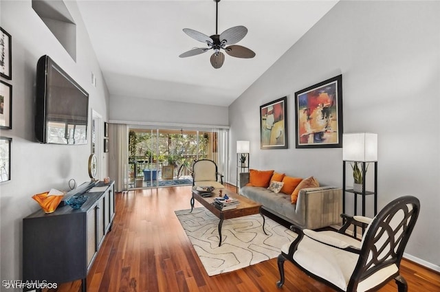 living area with ceiling fan, baseboards, vaulted ceiling, and dark wood-style flooring