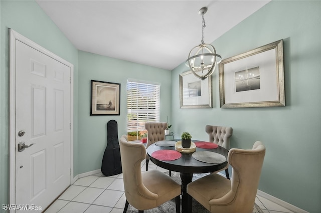 tiled dining space featuring a notable chandelier