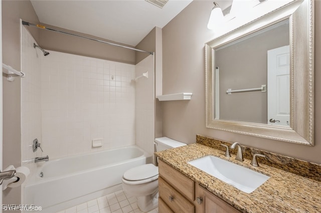 full bathroom with tiled shower / bath combo, vanity, tile patterned floors, and toilet