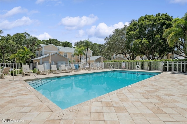 view of swimming pool with a patio area