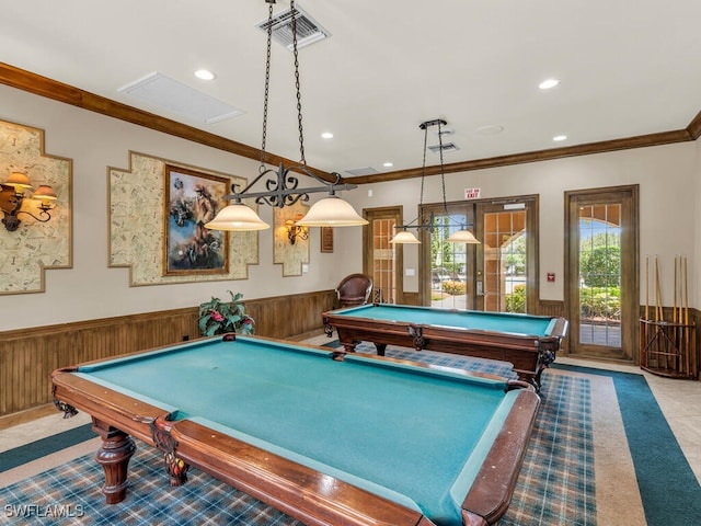 recreation room with billiards, ornamental molding, and wooden walls