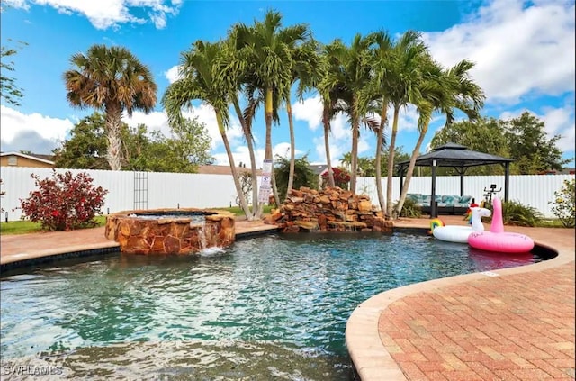 1797 42nd Ter SW, Naples, FL 34116 - view of pool with a gazebo, a fenced backyard, and a pool with connected hot tub