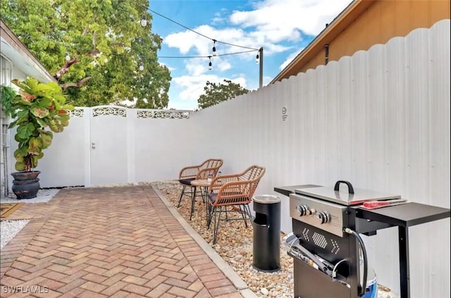 1797 42nd Ter SW, Naples, FL 34116 - view of patio / terrace featuring a fenced backyard and area for grilling