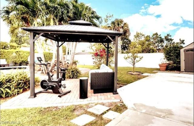 1797 42nd Ter SW, Naples, FL 34116 - view of patio featuring a fenced backyard and a gazebo