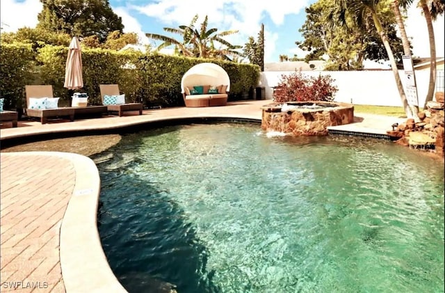 1797 42nd Ter SW, Naples, FL 34116 - view of swimming pool with a pool with connected hot tub, fence, and a patio area