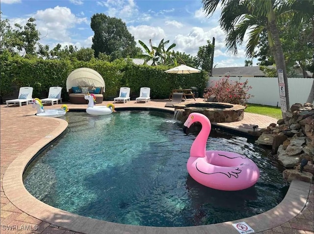 1797 42nd Ter SW, Naples, FL 34116 - view of pool featuring a fenced backyard, a patio, and a pool with connected hot tub