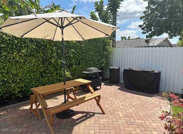 1797 42nd Ter SW, Naples, FL 34116 - view of patio / terrace featuring fence and outdoor dining space