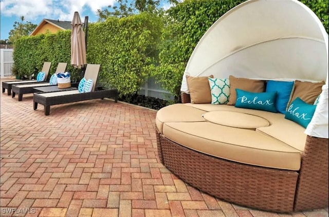 1797 42nd Ter SW, Naples, FL 34116 - view of patio with outdoor lounge area and fence