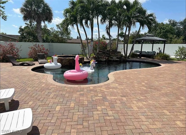 1797 42nd Ter SW, Naples, FL 34116 - view of swimming pool featuring a fenced backyard, a patio, and a gazebo