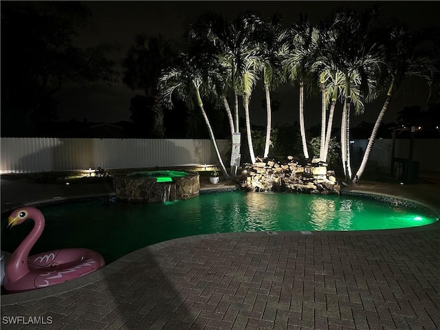1797 42nd Ter SW, Naples, FL 34116 - pool at twilight with a patio, fence, and a pool with connected hot tub