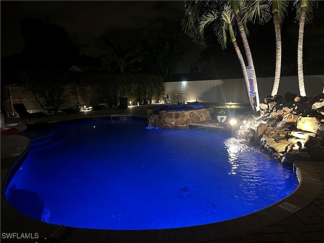 1797 42nd Ter SW, Naples, FL 34116 - pool at twilight featuring an outdoor hot tub and fence