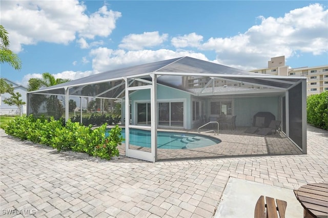 8339 Estero Blvd, Fort Myers Beach, FL 33931 - outdoor pool featuring glass enclosure and a patio area