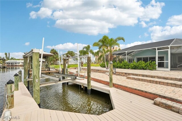8339 Estero Blvd, Fort Myers Beach, FL 33931 - dock area featuring a lanai, boat lift, and a water view