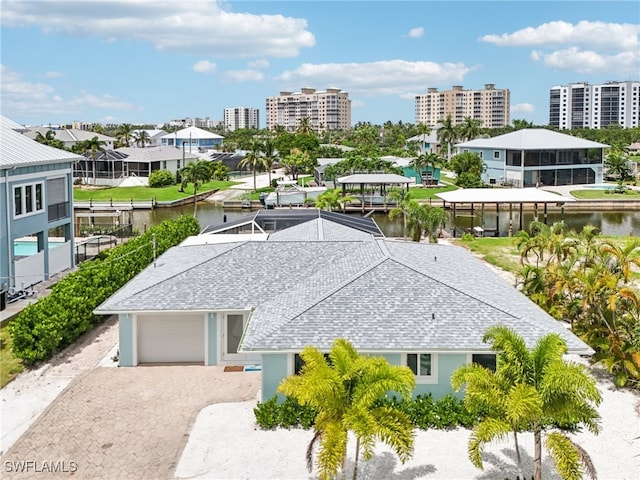 birds eye view of property featuring a water view