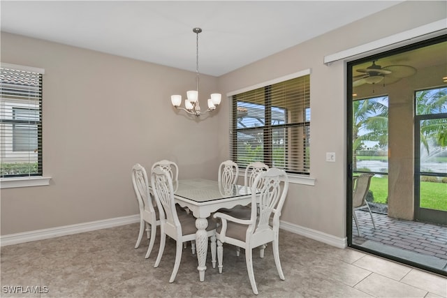 dining space featuring an inviting chandelier