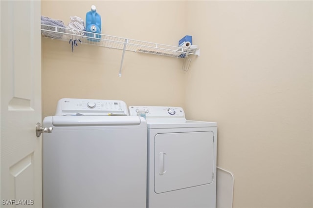 laundry room with washer and clothes dryer