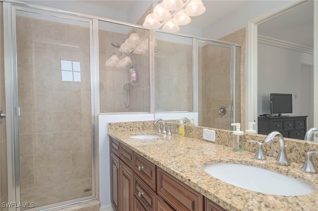 bathroom featuring vanity and an enclosed shower