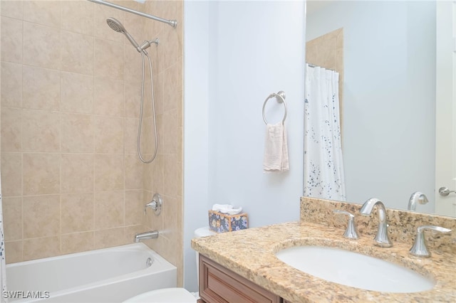 full bathroom featuring vanity, shower / tub combo, and toilet